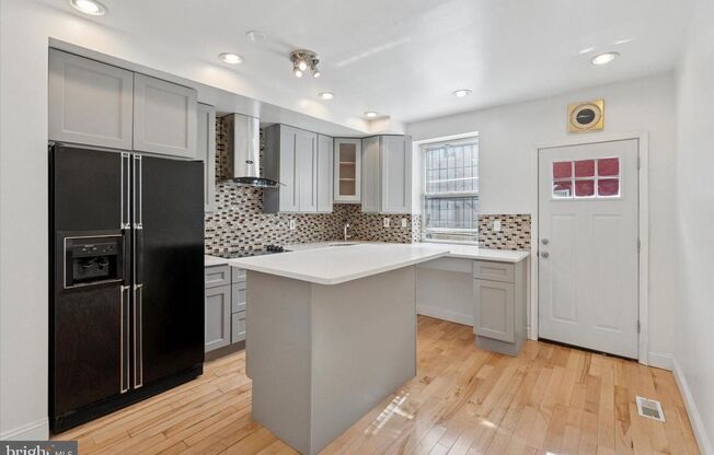 Updated 2BR Townhome with Dual Ensuite Baths, Hardwood Floors & Private Patio in Grays Ferry