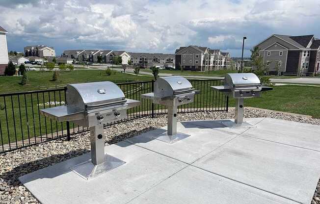 Stainless steel gills on a concrete base at Andover Pointe Apartment Homes, La Vista, NE, 68138