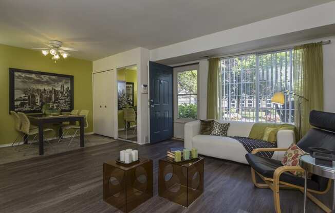 a living room with a couch and a table at Village Club of Rochester Hills, Shelby Township Michigan