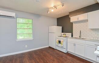 a kitchen with an island in the middle of a room