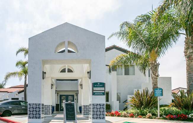 a building with a palm tree in front of it