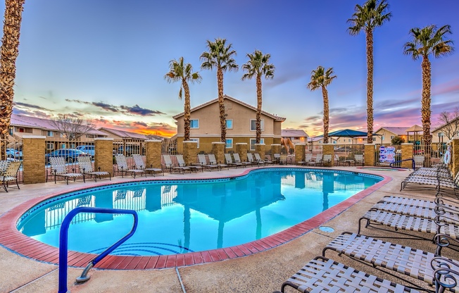 North Las Vegas, NV, Apartments for Rent - Portola Del Sol - Pool with Lounge Chairs and Palm Trees