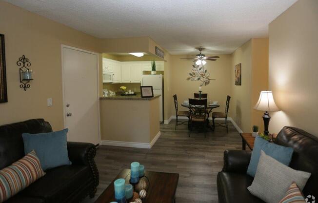 Living Room With Kitchen View at Citrus Gardens Apartments, Fontana, CA 92335
