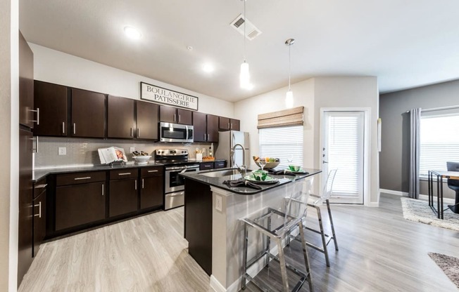 Model 2 - Open Floor Plan with Kitchen Island & Private Patio at Legacy Creekside Apartments, San Antonio, TX