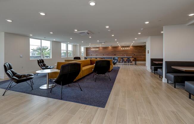 a living room filled with furniture and a large window