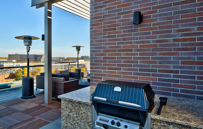 Grill and patio seating on the roof