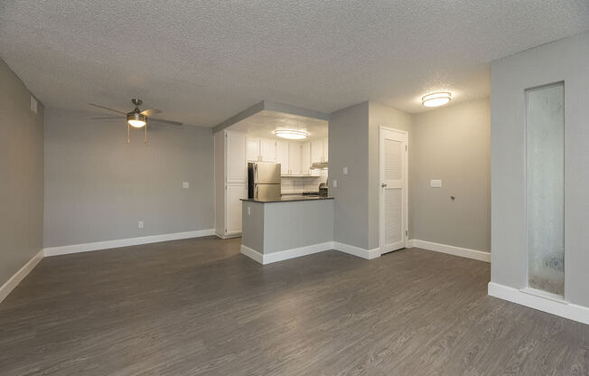 Living and dining area near kitchen l Vue at the Lake in Sacramento