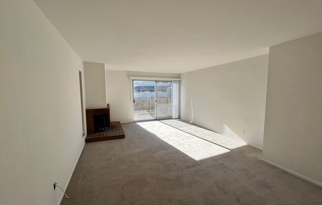 LARGE ONE BED ONE AND HALF BATH UPPER END UNIT CONDO WITH GREAT STORAGE AND TWO COVERED PARKING STALLS