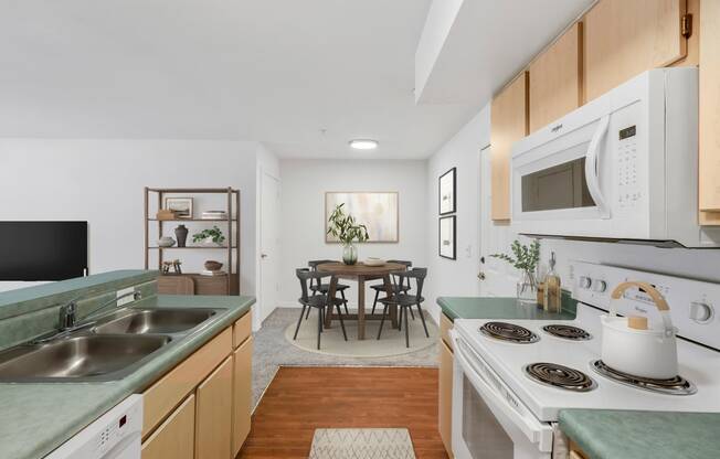 a kitchen with green countertops and white appliances