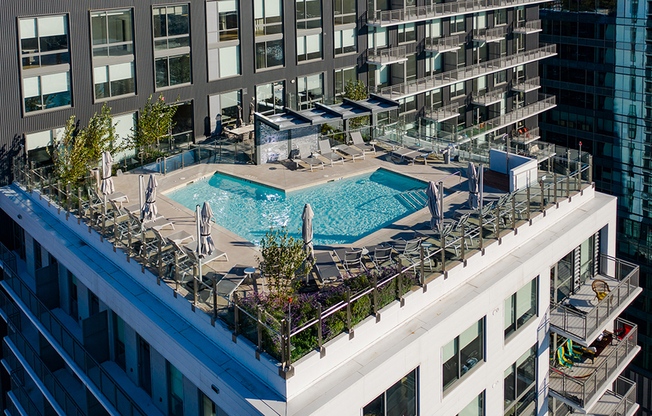 Enjoy a hot summer day in a cabana at this lavish L shaped pool