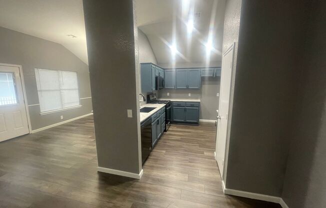 Completely remodeled 4 bedroom in Moore ready for move in ! New countertops and appliances, luxury vinyl flooring, new fixtures, small fenced yard with storm shelter, storage shed and a view!!