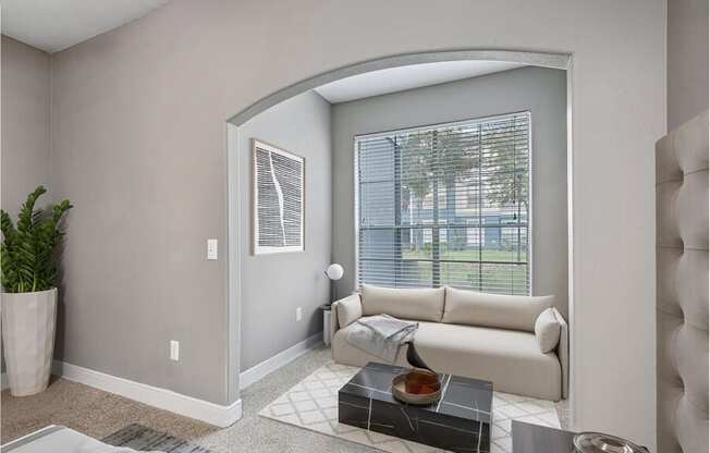 Model living room showcasing large windows