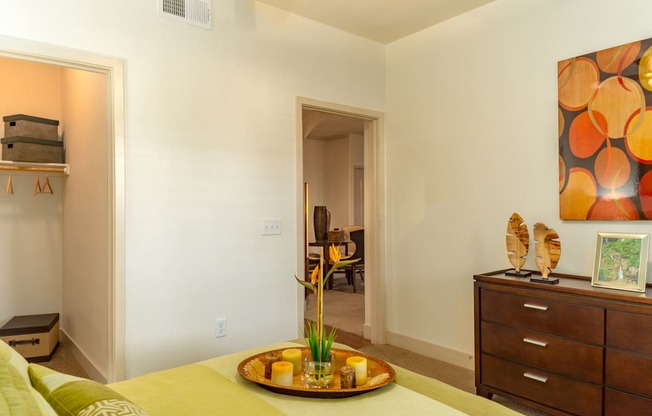 a bedroom with a bed and a dresser