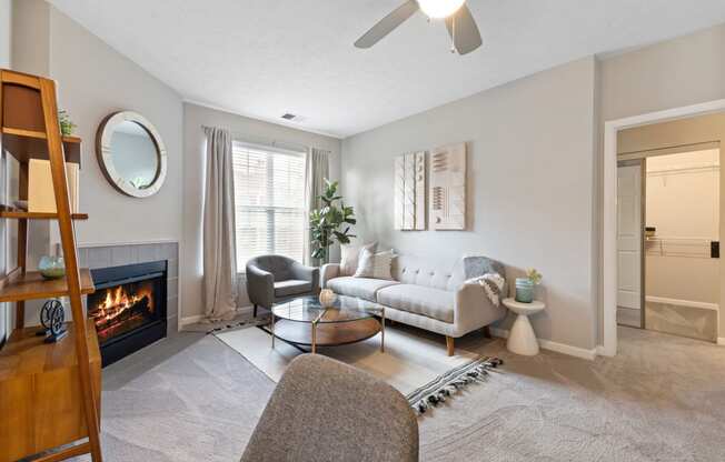 a living room with a couch and a fireplace