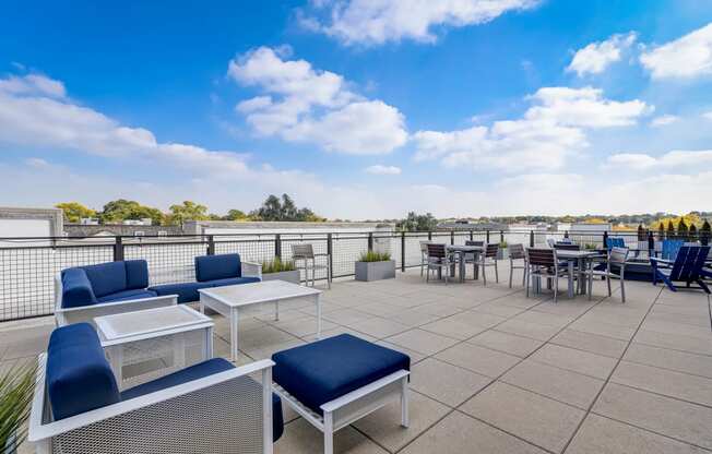 the terrace of the building has seating and tables at Barrington 101, Chicago