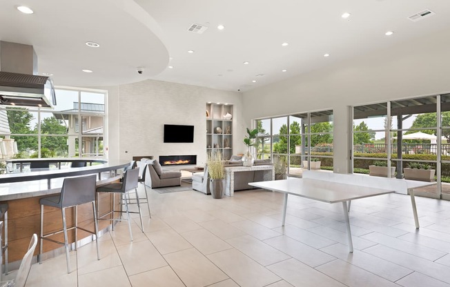 a living room filled with furniture and a large window
