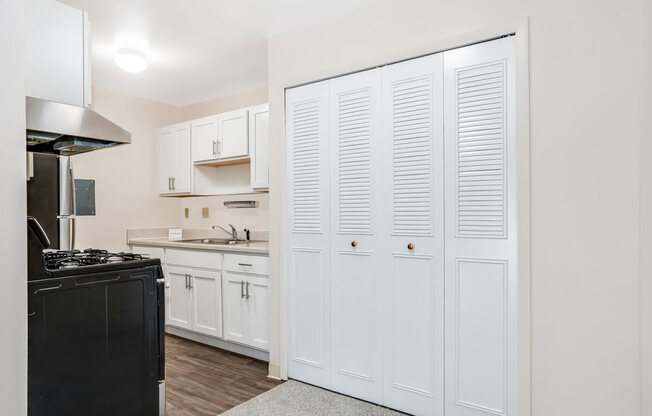 Kitchen with Stainless Steel Appliances Private Balcony at Wood Creek Apartments in Kenosha, WI