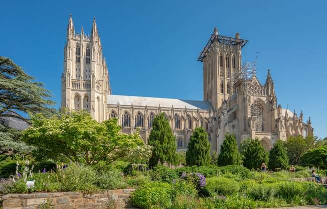 a cathedral with a garden in front of it