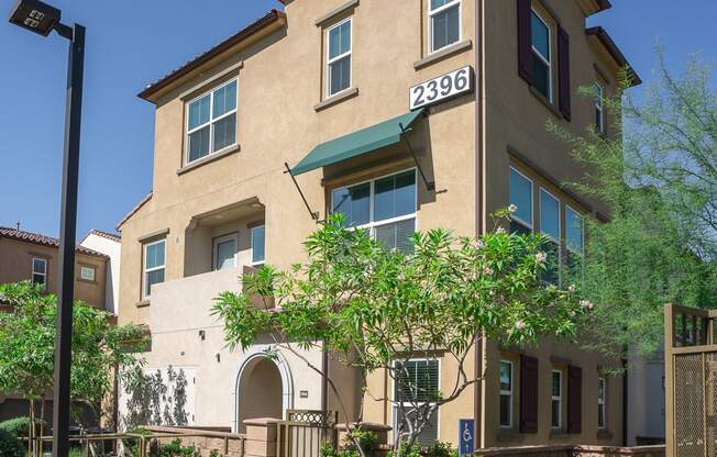 Apartment complex with sidewalks and vegetation