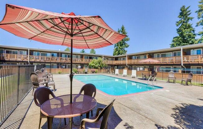 Pool deck with table and chairs