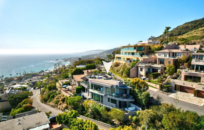 Contemporary Modern Masterpiece with Rooftop Deck and White Water Ocean Views in Laguna Beach