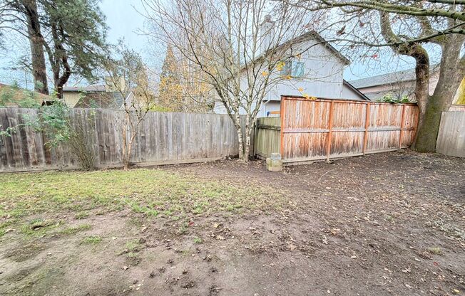 Comfortable Beaverton Home with AC, Fireplace, Large Fenced Yard, Spacious Garage and W/D!
