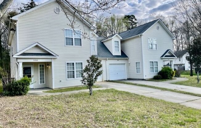 Must see this 4 bedroom 2.5 bath townhouse with 1 car garage .