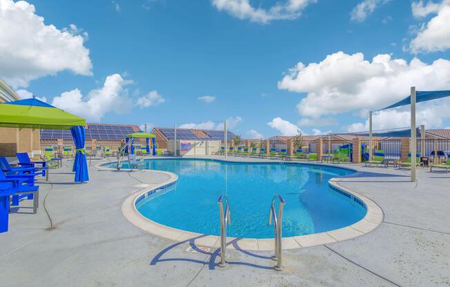 a blue umbrella sitting on top of a sandy beach