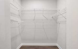 Spacious closets with shelving, perfect for organizing shoes and clothes.