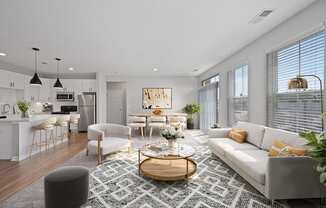 A modern living room with a white sofa and a coffee table.