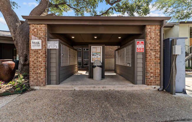 A mail center with a sign on the wall.