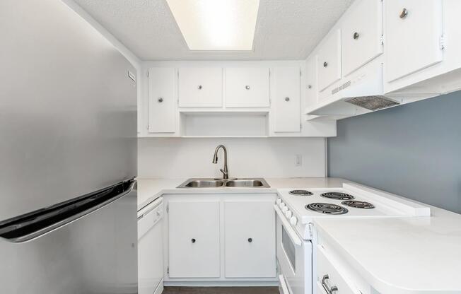 a kitchen with a stove and a sink