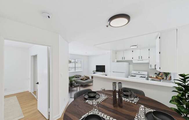 A modern dining room with a wooden table set for a meal.