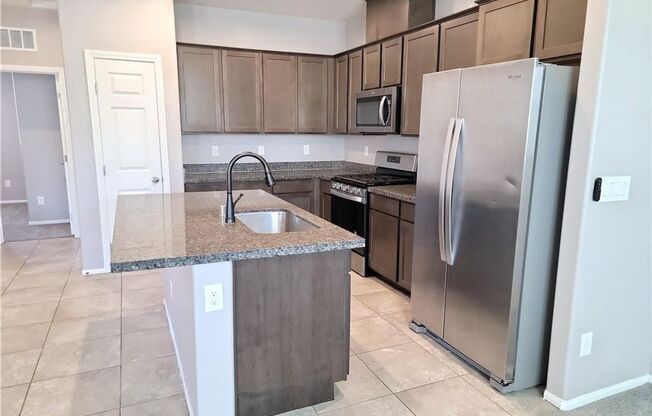 Modern Henderson Townhome with First-Floor Primary Suite & Mountain Views!