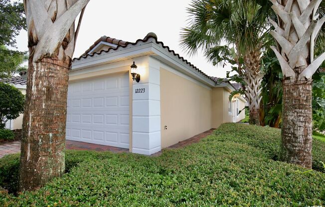 Beautiful 3/2 Corner Duplex with Water View in Highly Sought After Gated Community of Village Walk - Lake Nona!