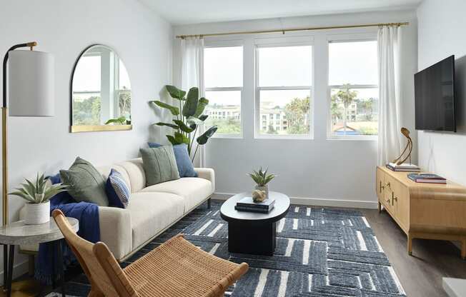 a living room with a couch and a table and a tv