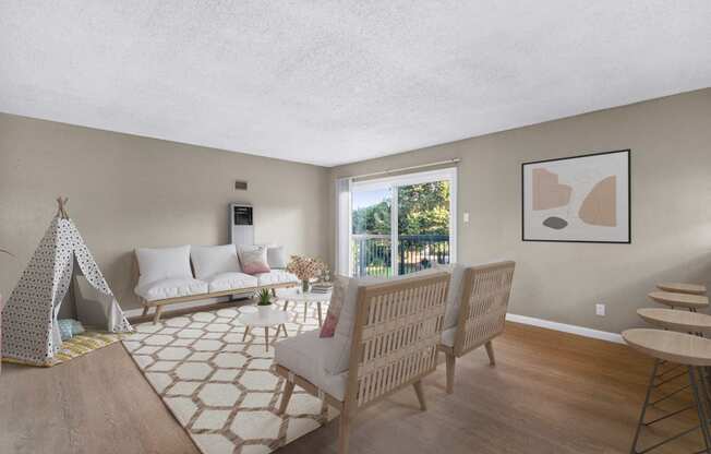 a living room with a couch and chairs and a table