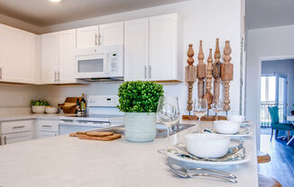 White Cabinetry and Appliances at Aviator at Brooks Apartments, Clear Property Management, San Antonio, TX, 78235