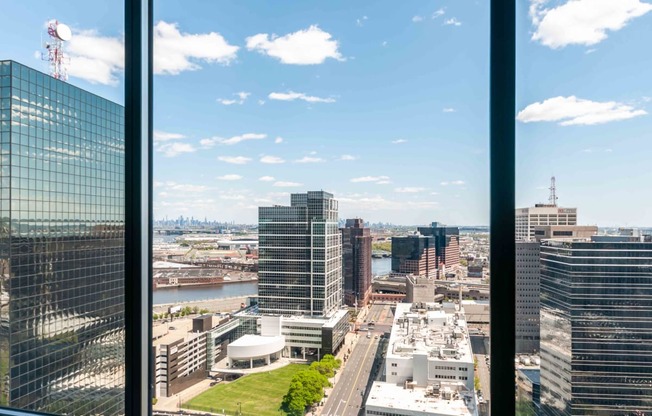 VIew of Newark skyline through apartment window