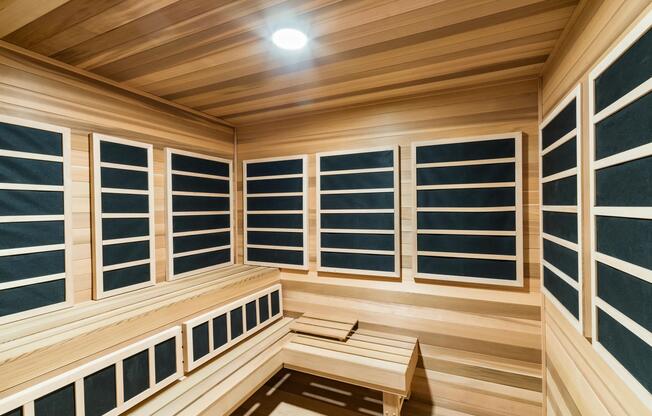 An infrared sauna with warm wood finishes and quiet seating, offering a restorative setting to unwind and reset at your own pace.