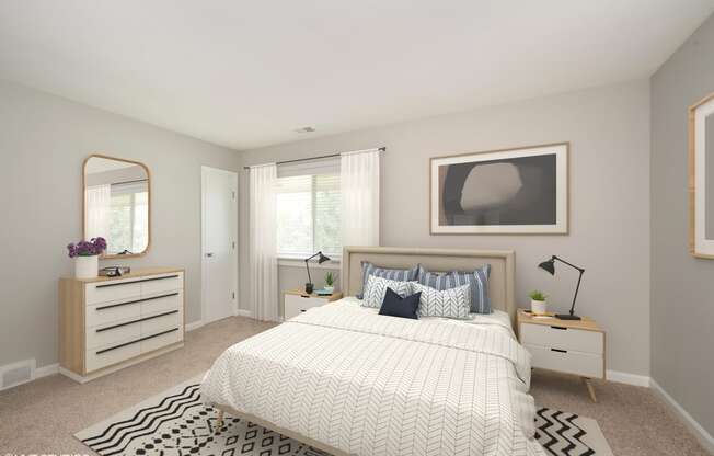 a bedroom with a large bed and a dresser with a mirror on it