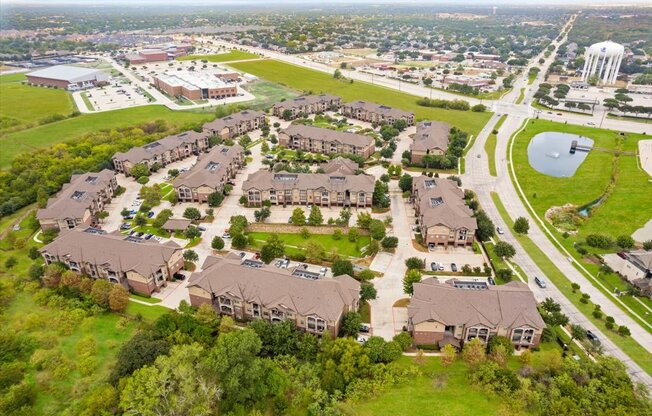 a neighborhood of houses on a grassy field