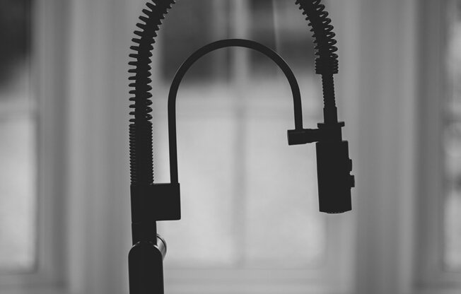 a black and white photo of a microphone on a table