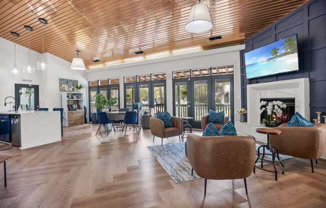 a living room with couches and chairs and a fireplace