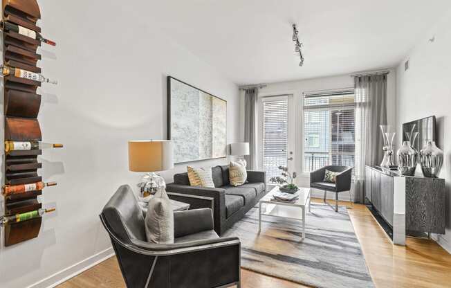 a living room with white walls and hardwood floors