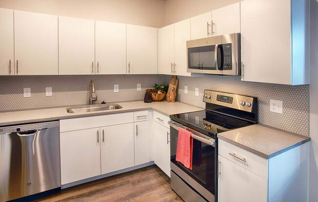 Kitchen with Appliances and White Cabinets