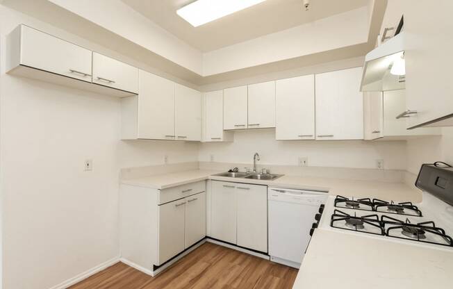 Kitchen with White Appliances and Hardwood Floors