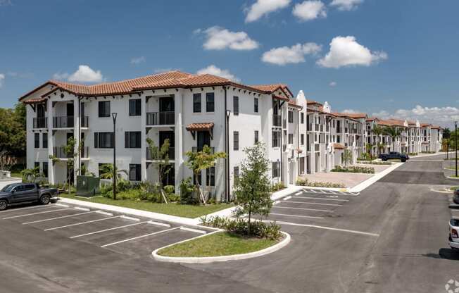 a row of apartment buildings on a street