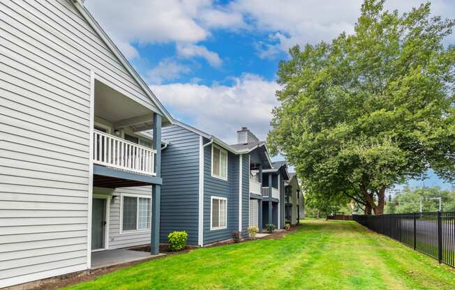 the preserve at ballantyne commons apartment community with blue and white houses and trees