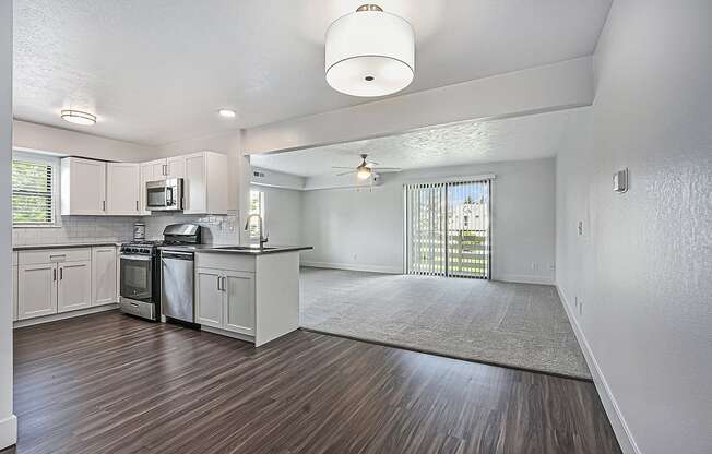 end style kitchen and living room at The Crossings Apartments, Michigan, 49508